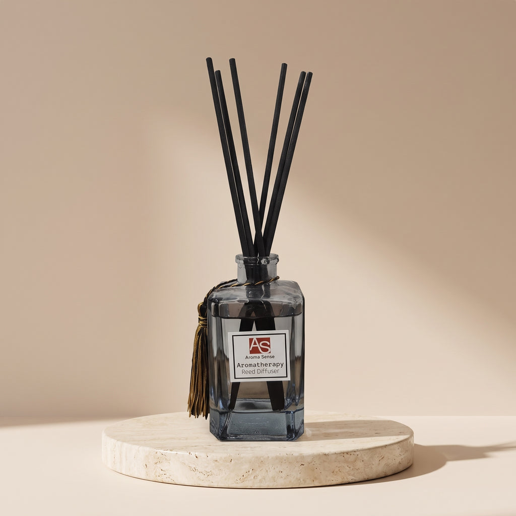 Aroma Sense 150ml blue glass reed diffuser with black reeds on a travertine stand