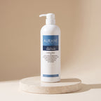 Aurané Balancing Conditioner 750ml on a travertine stand