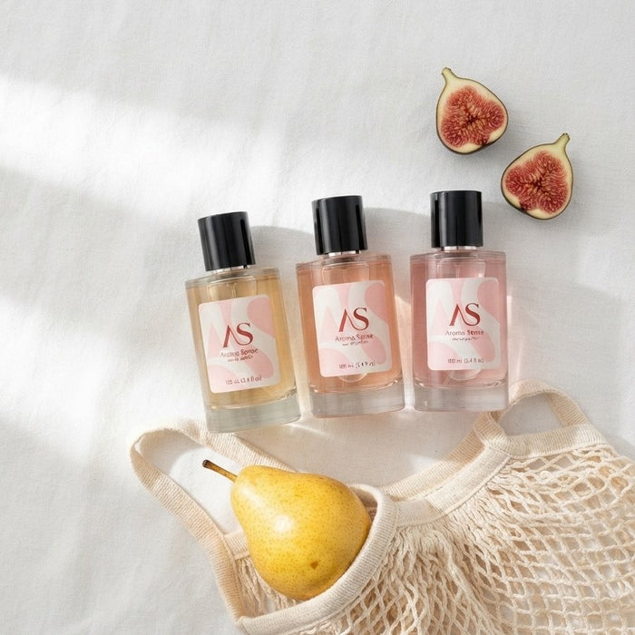 Aroma Sense eau de parfum bottles with figs and a pear